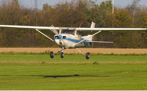 00-PRG flying above runway